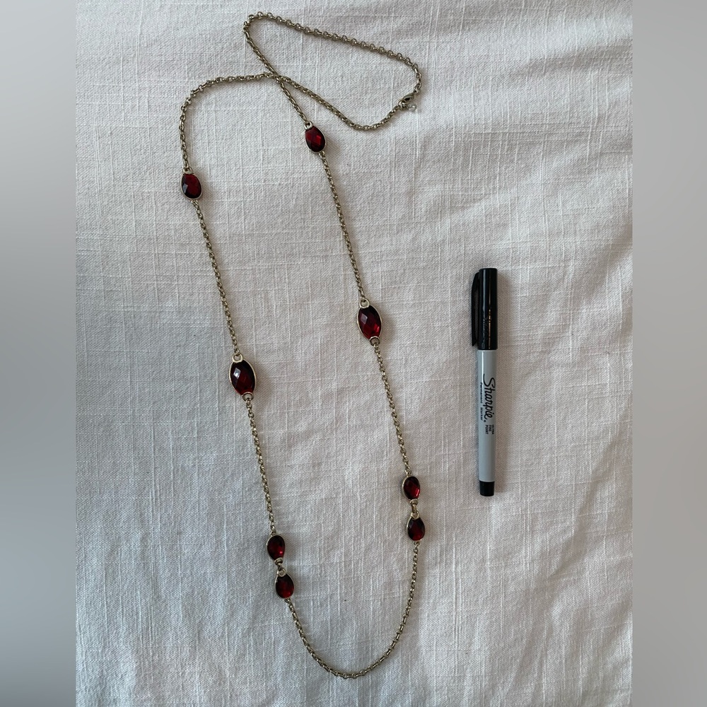 Long gold chain necklace with red gems